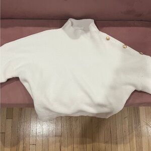 Beautiful cream fitted sweater with gold buttons.